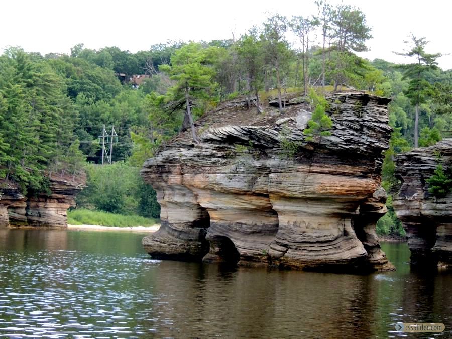 Many small islands of rock on river...