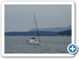 Sailing boat anchored in fjord