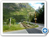 Railway crossing - road would lead you to Flam