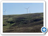 Wind farm on top of berm by lake