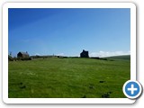 House and church at end of loch